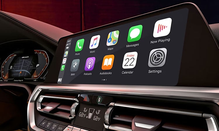 Interior view of the BMW 4 Series Coupe showcasing advanced features like Apple CarPlay™ and wireless Android Auto™, a digital instrument cluster and more.