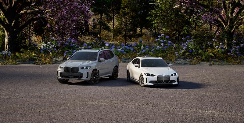 BMW Electric vehicles parked in a spring landscape.