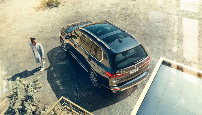 Aerial view of a BMW X7 showcasing the standard three-panel Panoramic Moonroof.