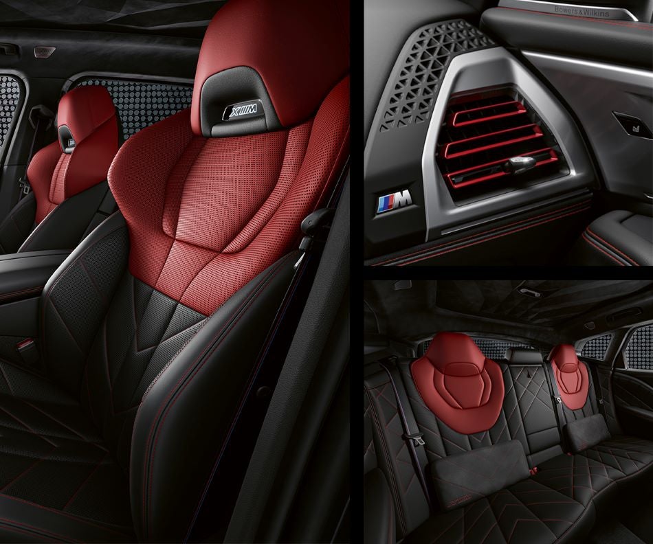 Detail of front seats, clad in exclusive BMW Individual Fiona Red & Black Merino Leather with exclusive M Signature Trim and red stitching and accents. Detail of red accented vent. Detail of rear M Lounge with exclusive XM pillows in BMW of Morristown | Morristown NJ